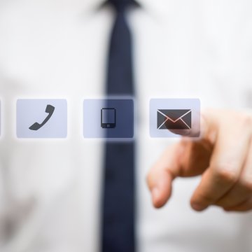 hellofax online fax service features man white shirt tie touching envelope e-mail icon with finger @ phone call smartphone symbols